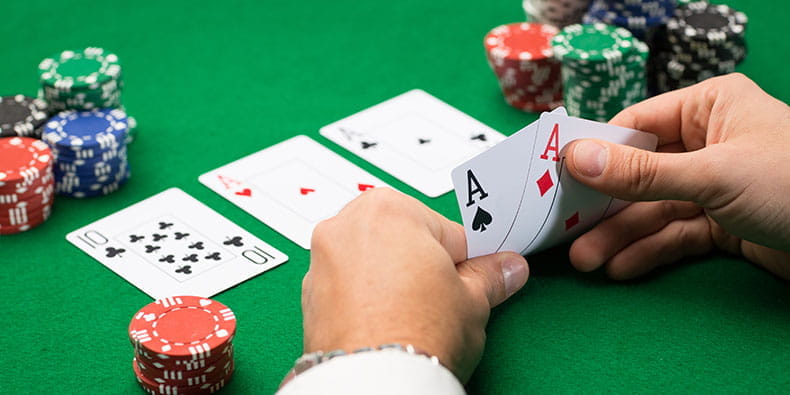 Man Holding Strong Poker Hand