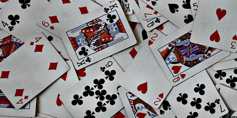 Mixed Playing Cards Laying on a Table