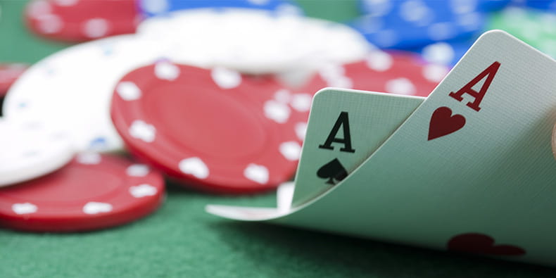 Blackjack Table Player Holding Winning Hand