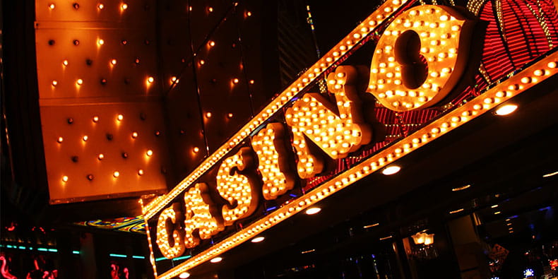 Bright Casino Sign With Many Lights