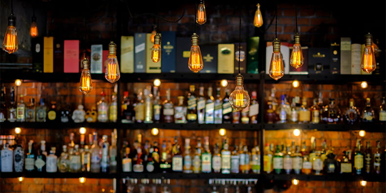 Bar Shelving with bottles of Alcohol