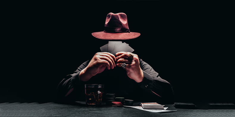 A Poker Player at a Casino Table with a Hat