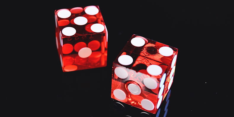 Casino dice on a black table 