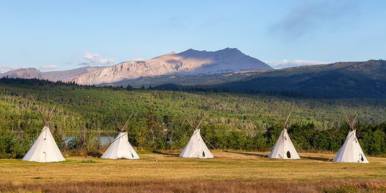 Native american tents in the wild nature 