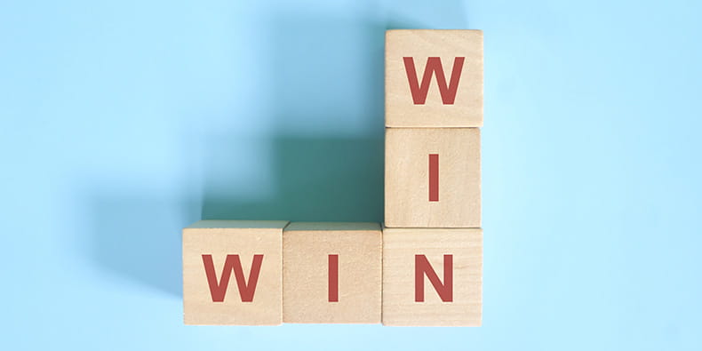 Win Win Solution Written with Wooden Cubes 