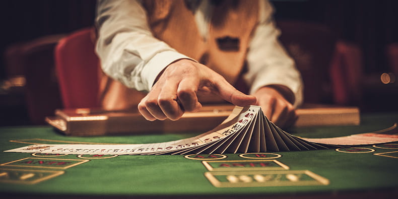  Croupier doing card tricks while shuffling the cards 